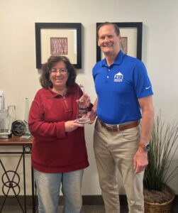 Pictured above: Sarah Peck with Phil Dunlevy of 2-10 Home Buyers Warranty